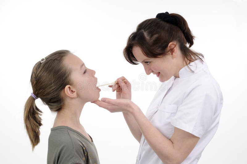 Doctor studying teenager mouth