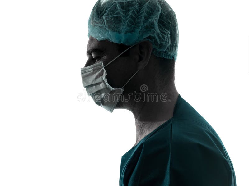 One caucasian doctor surgeon man portrait profile with face mask medical worker silhouette isolated on white background. Side profile mask stock images, royalty-free photos and pictures