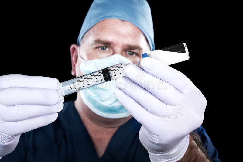 Doctor and syringe stock photo. Image of drugs, male 28962932