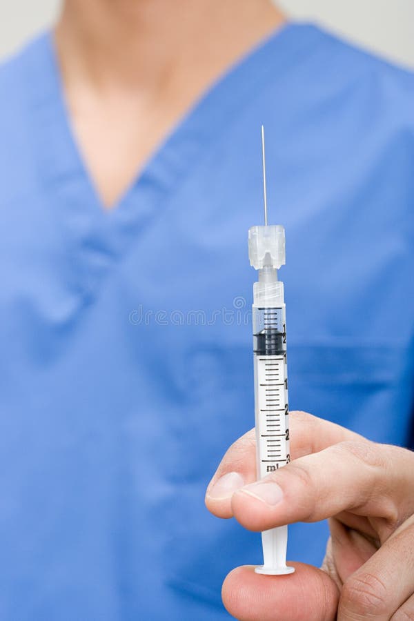 Doctor with syringe stock image
