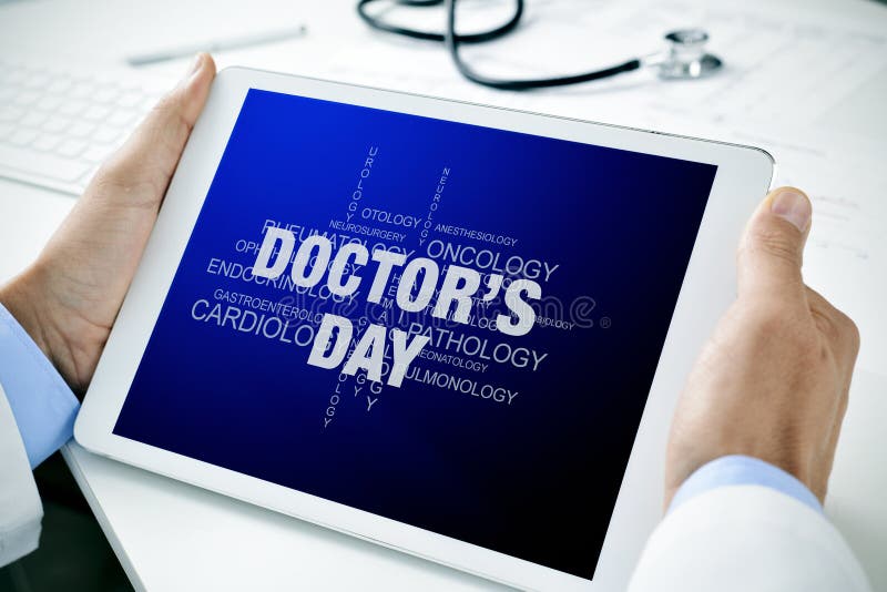 Doctor with a tablet with the text doctors day royalty free stock image Doctor with a tablet with the text doctors day royalty free stock image