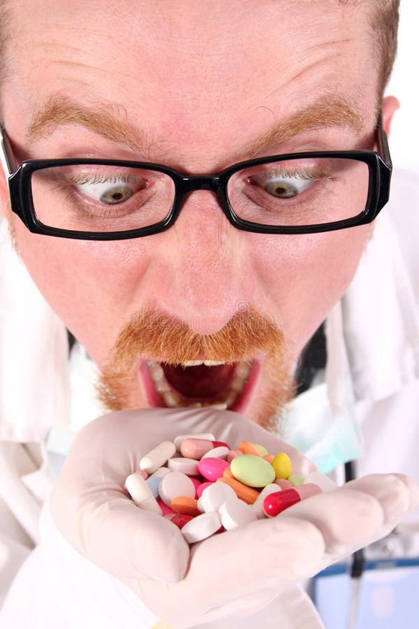 Doctor taking hand full of tablets