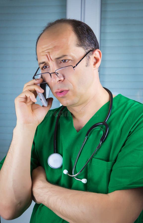 Doctor talking on cell phone