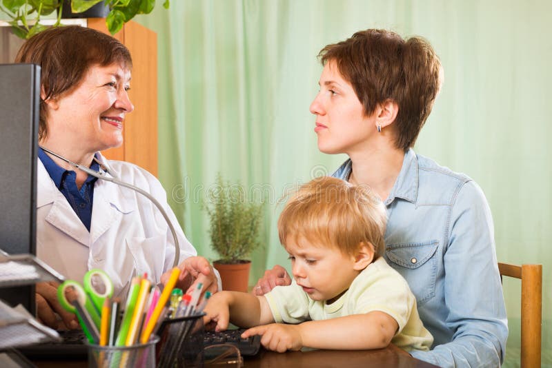 Doctor Talking with Mother of Baby Stock Photo Image of clinic