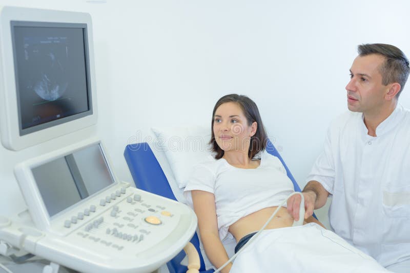 Doctor with ultrasound scan woman belly stock images Doctor with ultrasound scan woman belly stock images