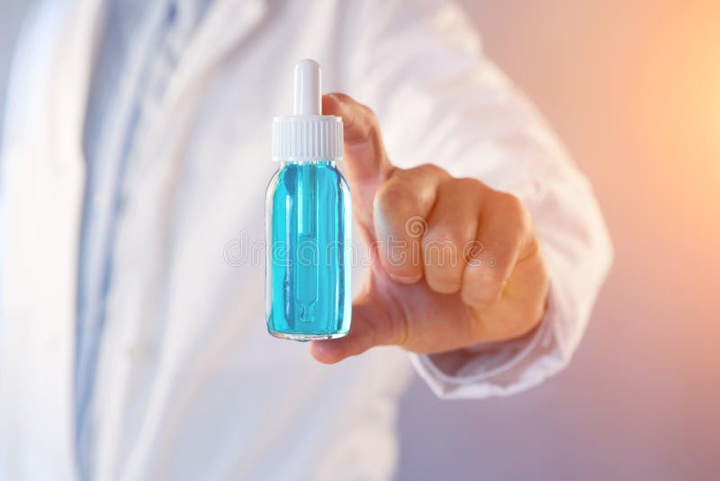Doctor using flask on a color background royalty free stock photos