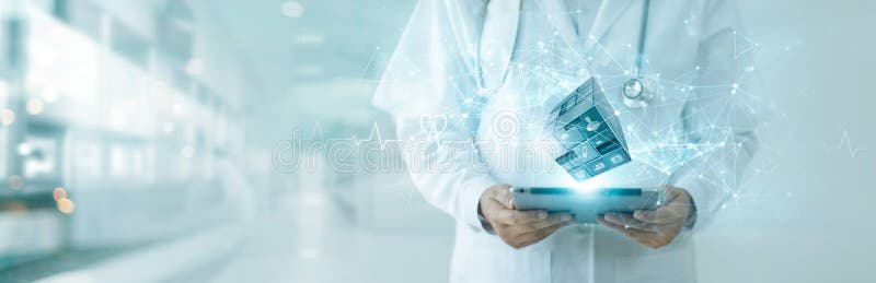 Doctor using tablet on digital medical cube interface icon. Digital healthcare and network connection on hologram. Technology stock image