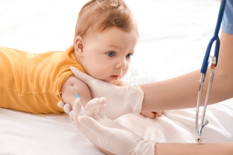 Doctor vaccinating little baby royalty free stock photos Doctor vaccinating little baby royalty free stock photos