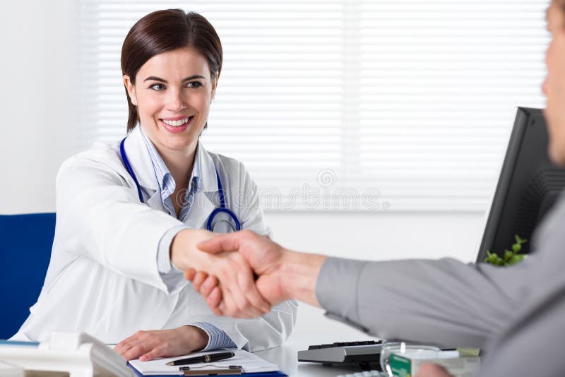 Doctor in white coat shake hand stock photography Doctor in white coat shake hand stock photography
