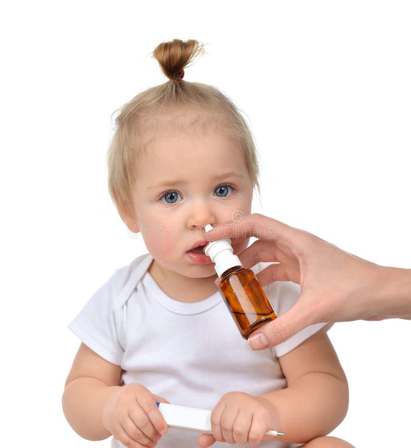 Doctor Woman hand using medicine nose spray nasal for baby toddler child kid royalty free stock photo Doctor Woman hand using medicine nose spray nasal for baby toddler child kid royalty free stock photo