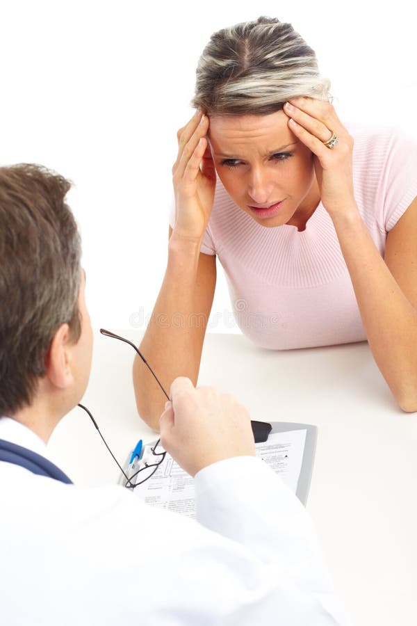 Doctor and woman patient stock photography