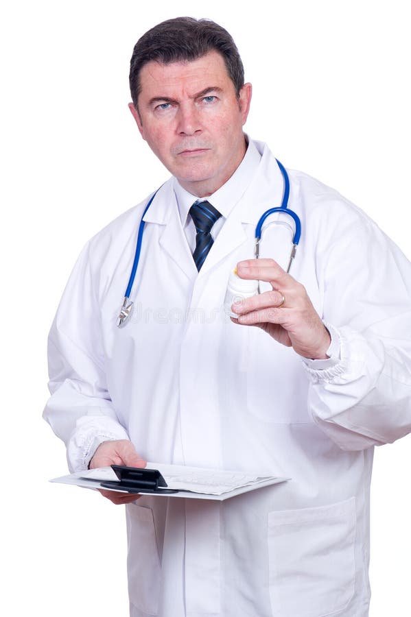 Serious doctor with pills stock image. Image of isolated - 18166891