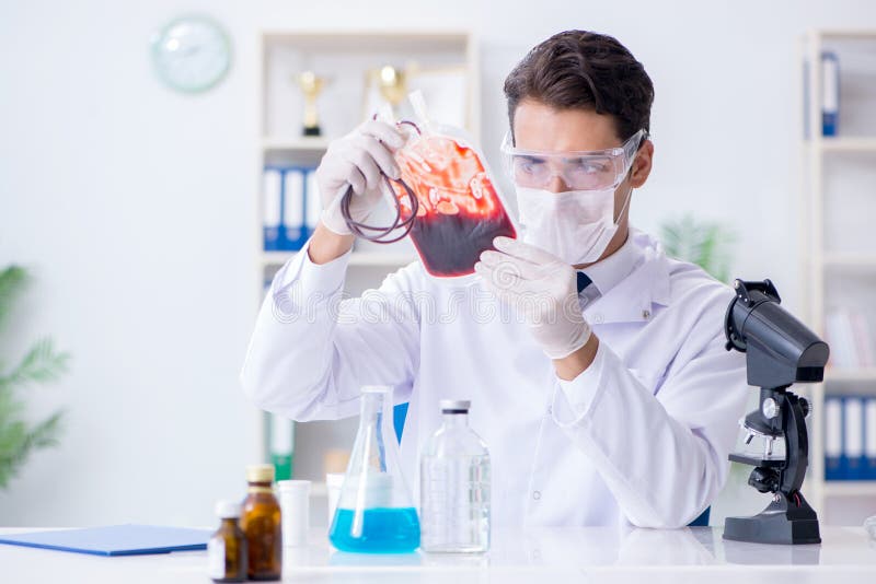 The Doctor Working with Blood Samples in Hospital Clinic Lab Stock