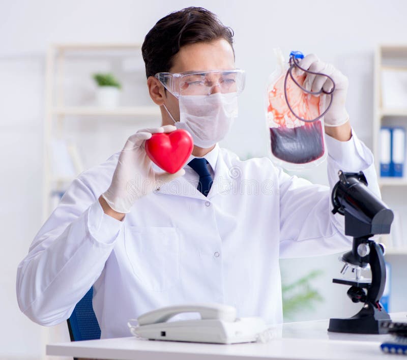 Doctor Working with Blood Samples in Hospital Clinic Lab Stock Photo