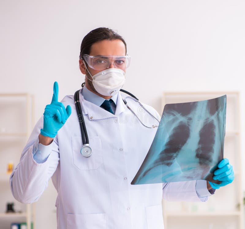 Doctor working in lab in coronavirus COVID-19 concept stock photo