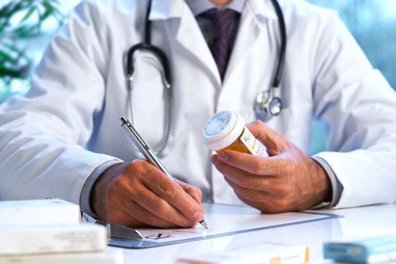 Doctor writing out RX prescription stock photos