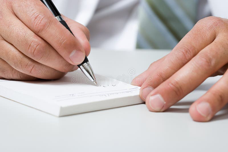 Doctor writing prescription stock images