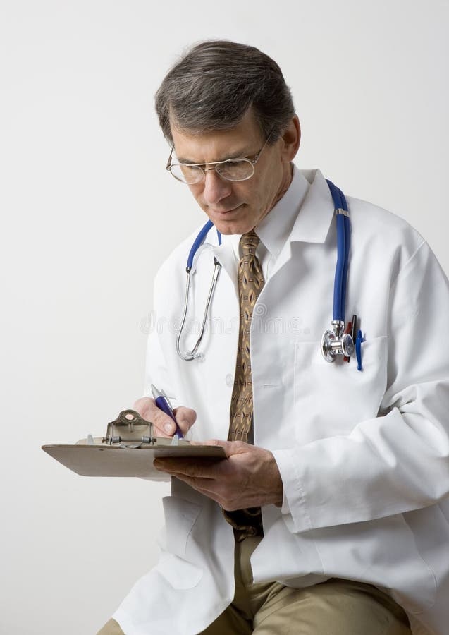 Doctor Writing A Prescription royalty free stock photo