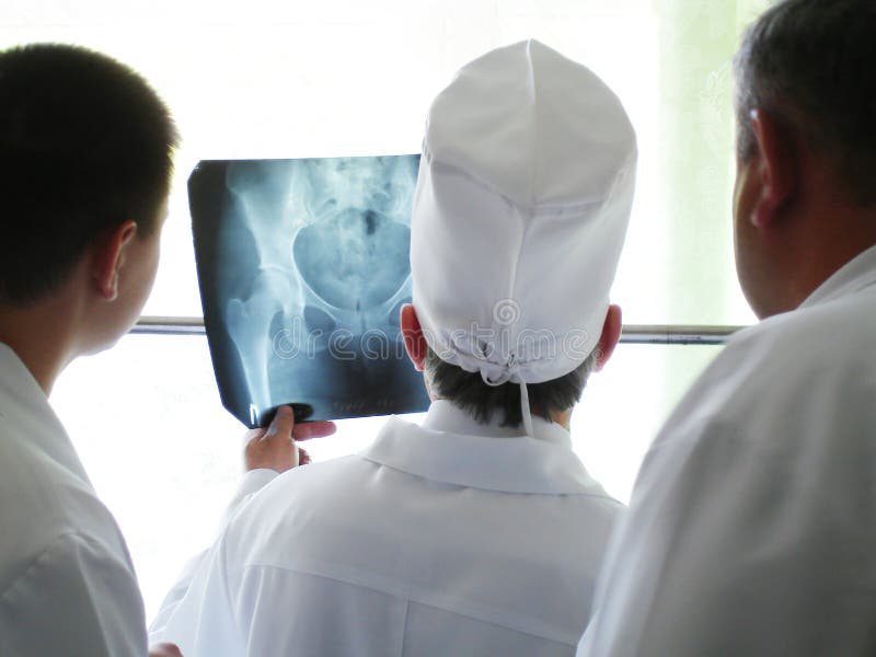 Doctors examine x-ray picture