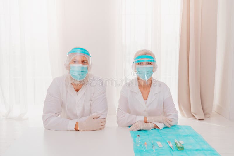 Doctors with Mask and Face Protector are Ready To Work in Hospital