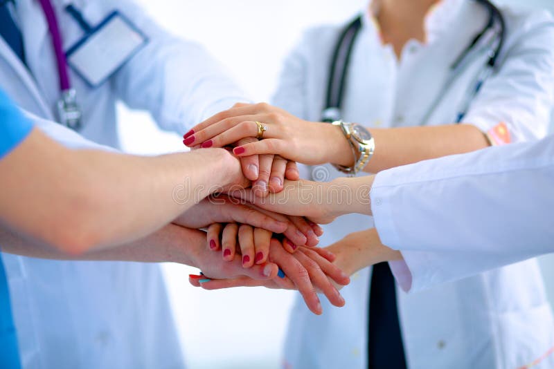 Doctors and nurses in a medical team stacking stock images Doctors and nurses in a medical team stacking stock images