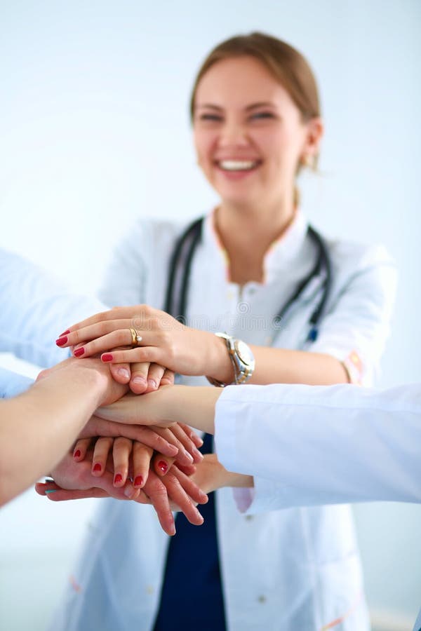 Doctors and Nurses in a Medical Team Stacking Hands Stock Photo Image