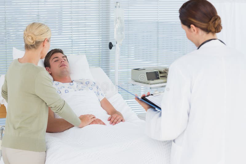 Doctors Taking Care of Patient Stock Photo Image of cheerful, medical 54248546