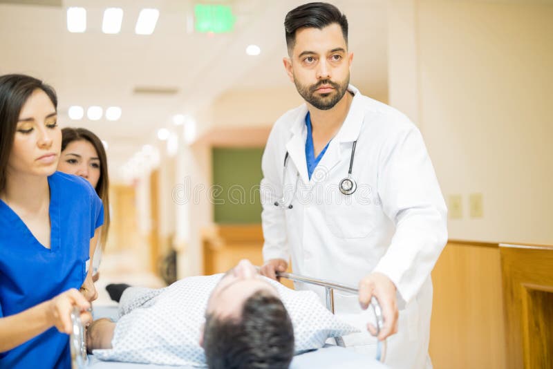 Doctors taking patient to the operating room royalty free stock photography Doctors taking patient to the operating room royalty free stock photography