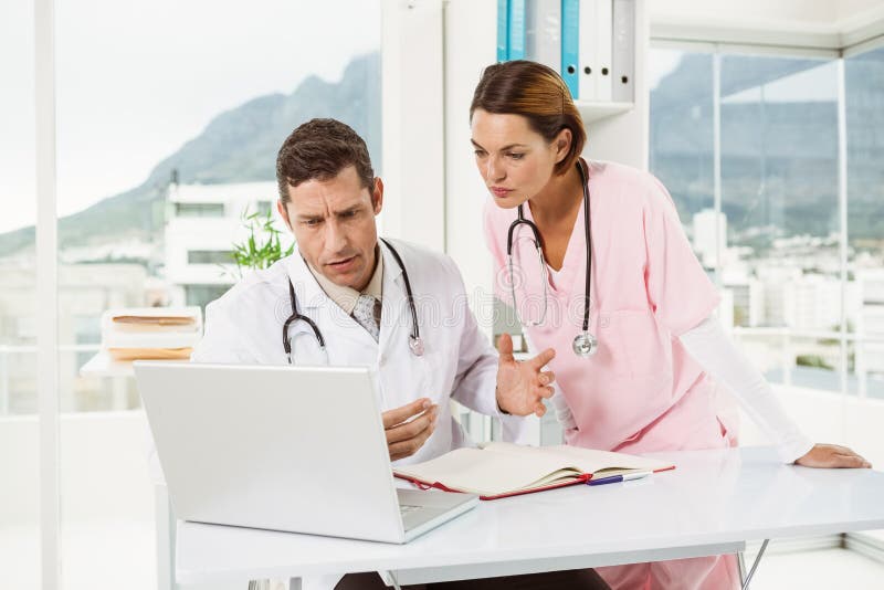 Doctors Using Laptop at Medical Office Stock Photo Image of stethos