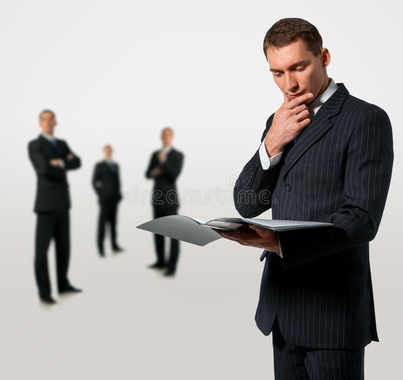 Businessman holding folder with documents