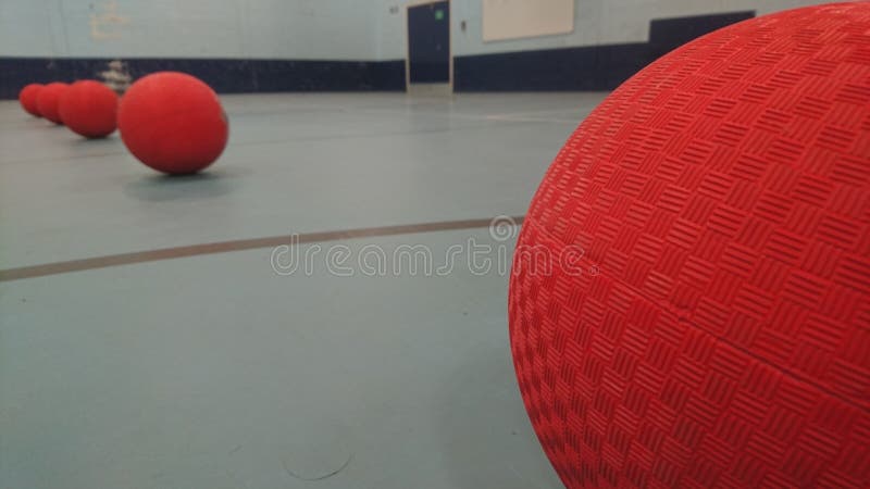 Close up of dodgeballs lined up