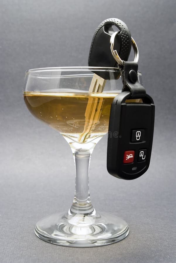 Champagne glass with key in the glass symbolizes that alcohol and driving don't mix. Champagne glass with key in the glass symbolizes that alcohol and driving don't mix.