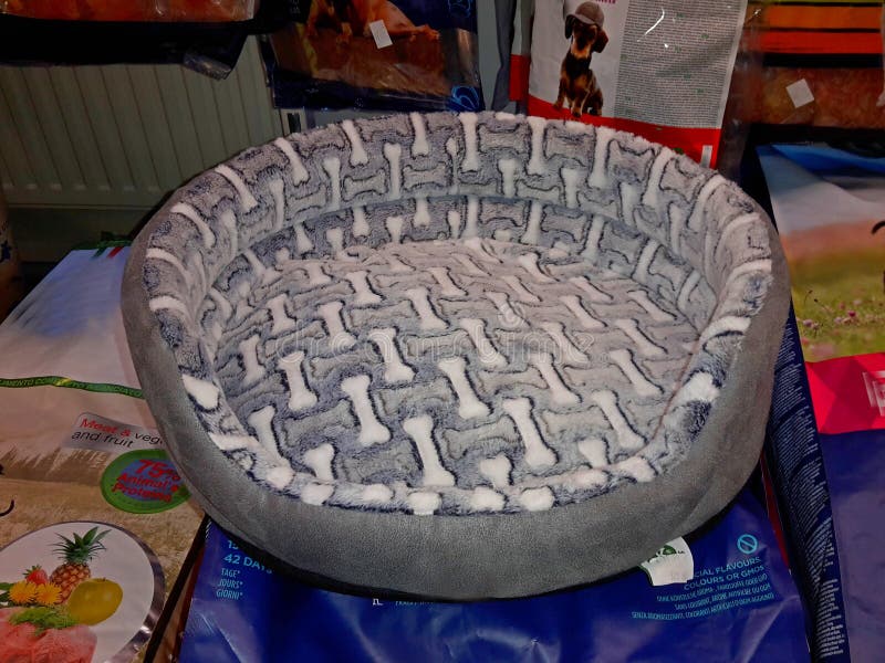Dog Bed Made of Gray Textile Fabric with a Motif of Bones, on the