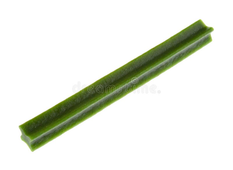Dog treats are chewy green stick isolated on white stock photo