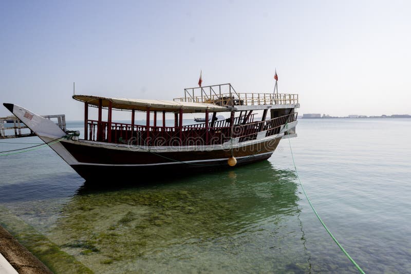 Traditional dhow on a background of a modern city of West Bay Doha, Qatar. royalty free stock photos