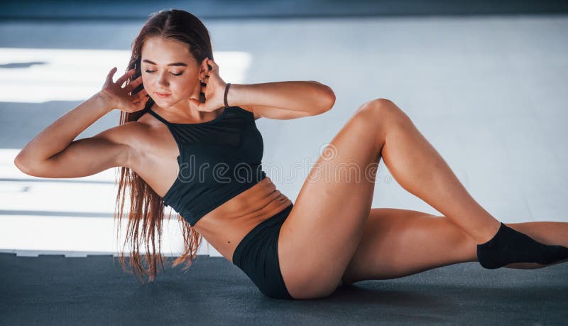 Doing Abs. Young Fitness Woman with Slim Type of Body and in Black Sportive Clothes is in the Gym Stock Image - Image of figure, clothes: 199093611 Doing Abs. Young Fitness Woman With Slim Type Of Body And In Black Sportive Clothes Is In The Gym Stock Image - Image Of Figure, Clothes: 199093611