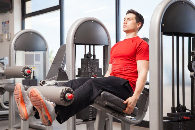 Doing Some Leg Extensions at the Gym Stock Photo Image of space