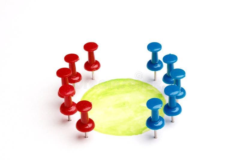 Symbol for a virtual green table meeting. Set of real pins with different colors on white background with shadows and a green circle. Separated. Copy space. Symbol for a virtual green table meeting. Set of real pins with different colors on white background with shadows and a green circle. Separated. Copy space