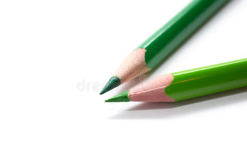 Two green pencils isolated on white. Two green pencils isolated on white