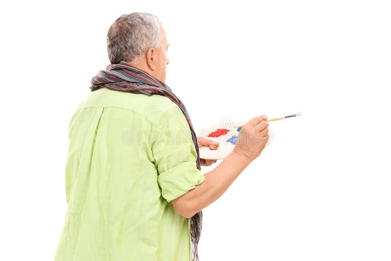 Dojrzały malarz trzyma paintbrush obrazy stock Dojrzały malarz trzyma paintbrush obrazy stock