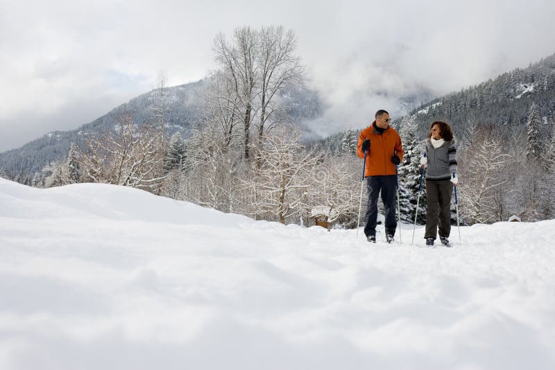 A mature couple skiing. A mature couple skiing