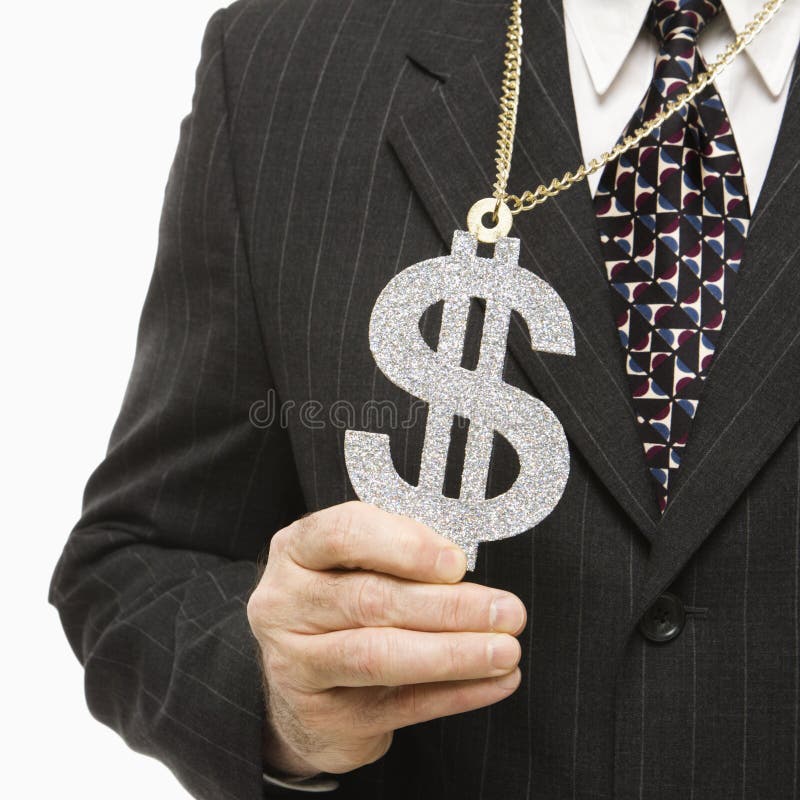 Close-up of Caucasian middle-aged businessman wearing chain necklace with oversized dollar sign. Close-up of Caucasian middle-aged businessman wearing chain necklace with oversized dollar sign.