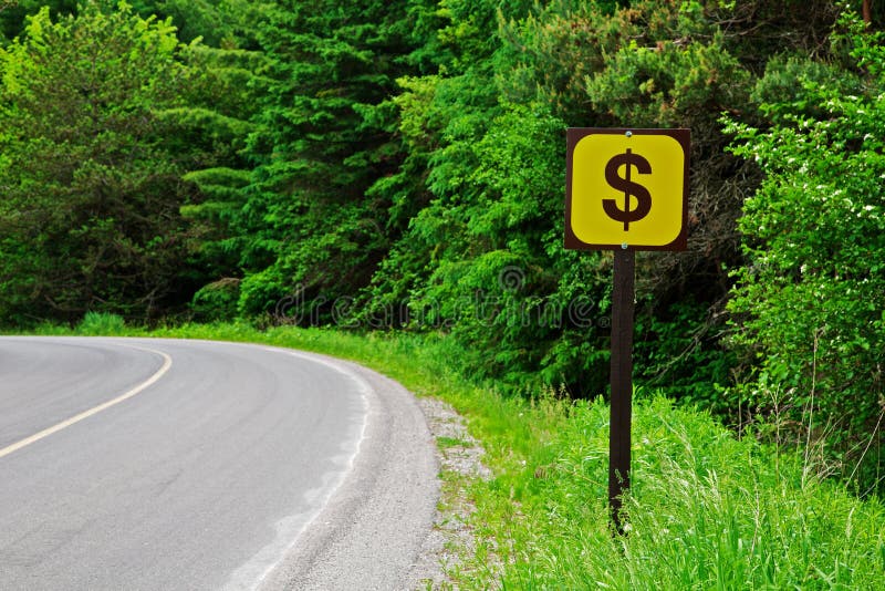 A Dollar Sign on a Side of a COuntry Road with a Copyspace. A Dollar Sign on a Side of a COuntry Road with a Copyspace