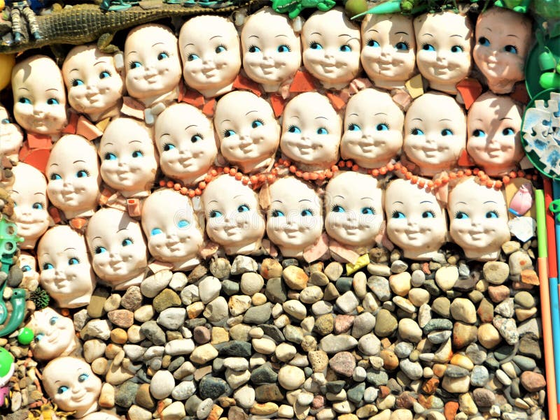 Doll faces and rocks as part of a unique display in Colorado.