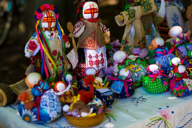 Doll is made of fabric. Sewn doll in a traditional costume, handmade. Doll motanka. Russian tradition the hand-made. A toy from fabric. Doll is made of fabric. Sewn doll in a traditional costume, handmade. Doll motanka. Russian tradition the hand-made. A toy from fabric.