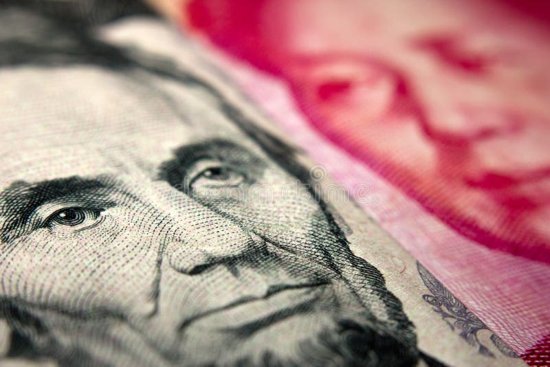 Close-up of an American dollar bill (showing Abraham Lincoln) and a Chinese yuan banknote (Mao Zedong). Close-up of an American dollar bill (showing Abraham Lincoln) and a Chinese yuan banknote (Mao Zedong)