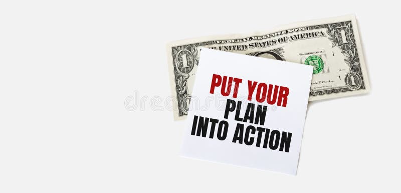 1 dollar bill and white notepad sheet on the white background. PUT YOUR PLAN INTO ACTION text stock images