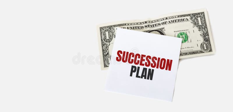 1 dollar bill and white notepad sheet on the white background. SUCCESSION PLAN text stock images