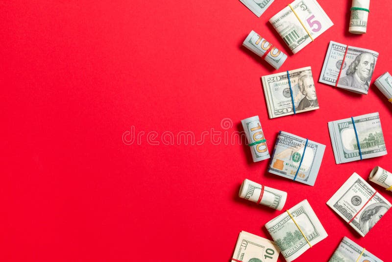 Dollar bills. Pile of one hundred US Dollar Bills money on colored background top wiev with copy space for your text in business