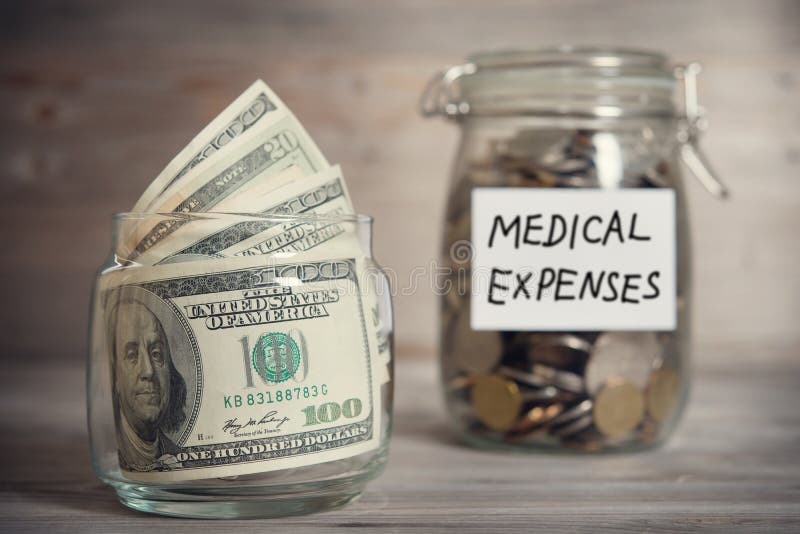 Dollars and coins in jar with medical expenses label